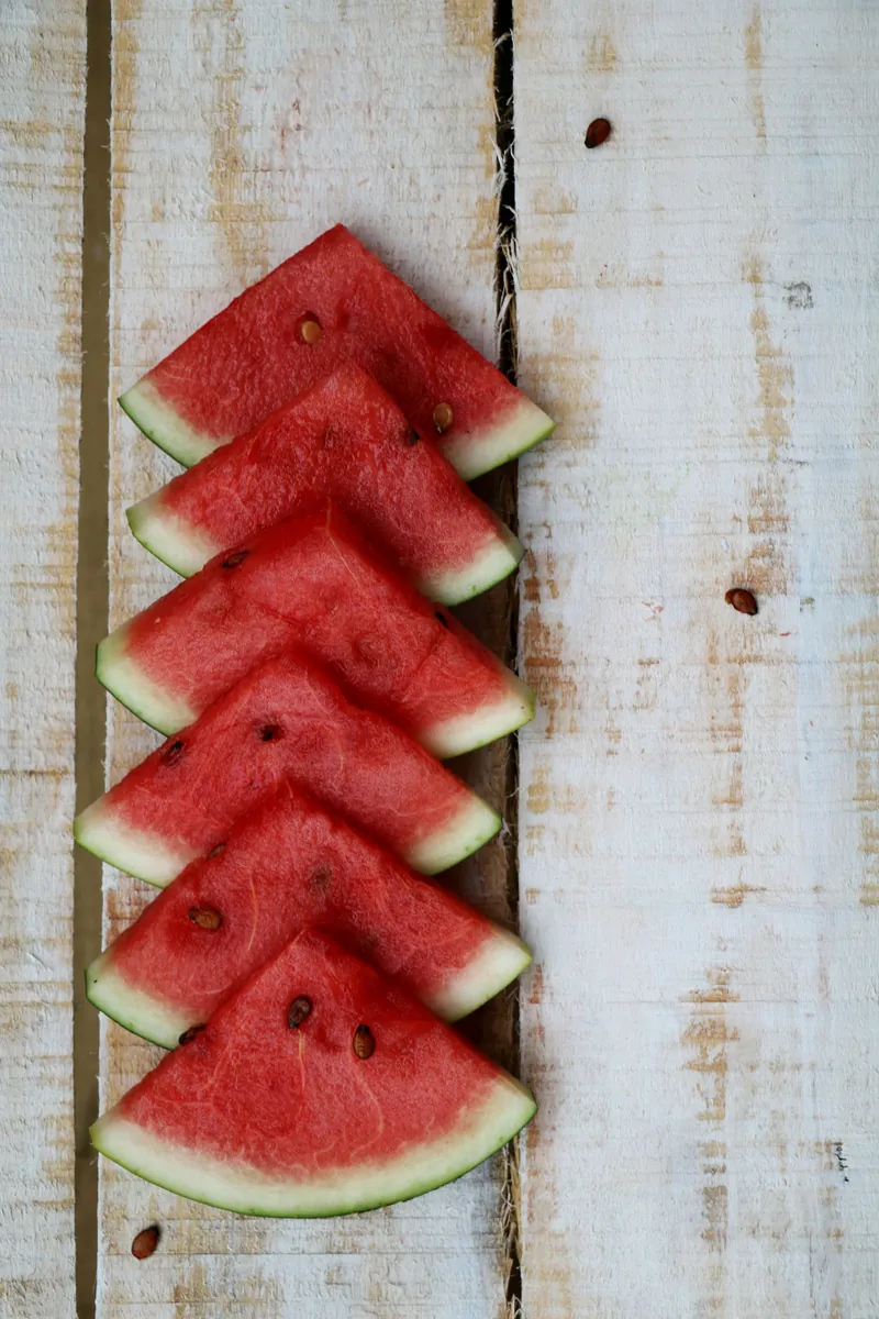Juicy watermelon slices at peak summer season on fruit season chart