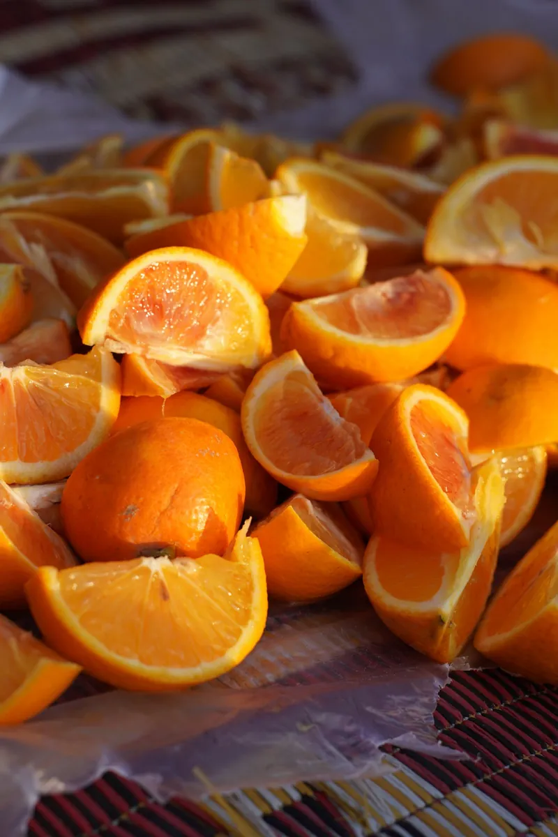 Fresh orange slices at peak winter citrus season on fruit season chart