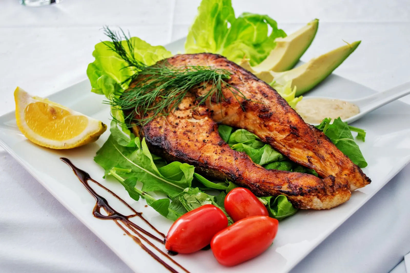 Grilled salmon fillet with beautiful char marks, cooked to a safe 145 degrees