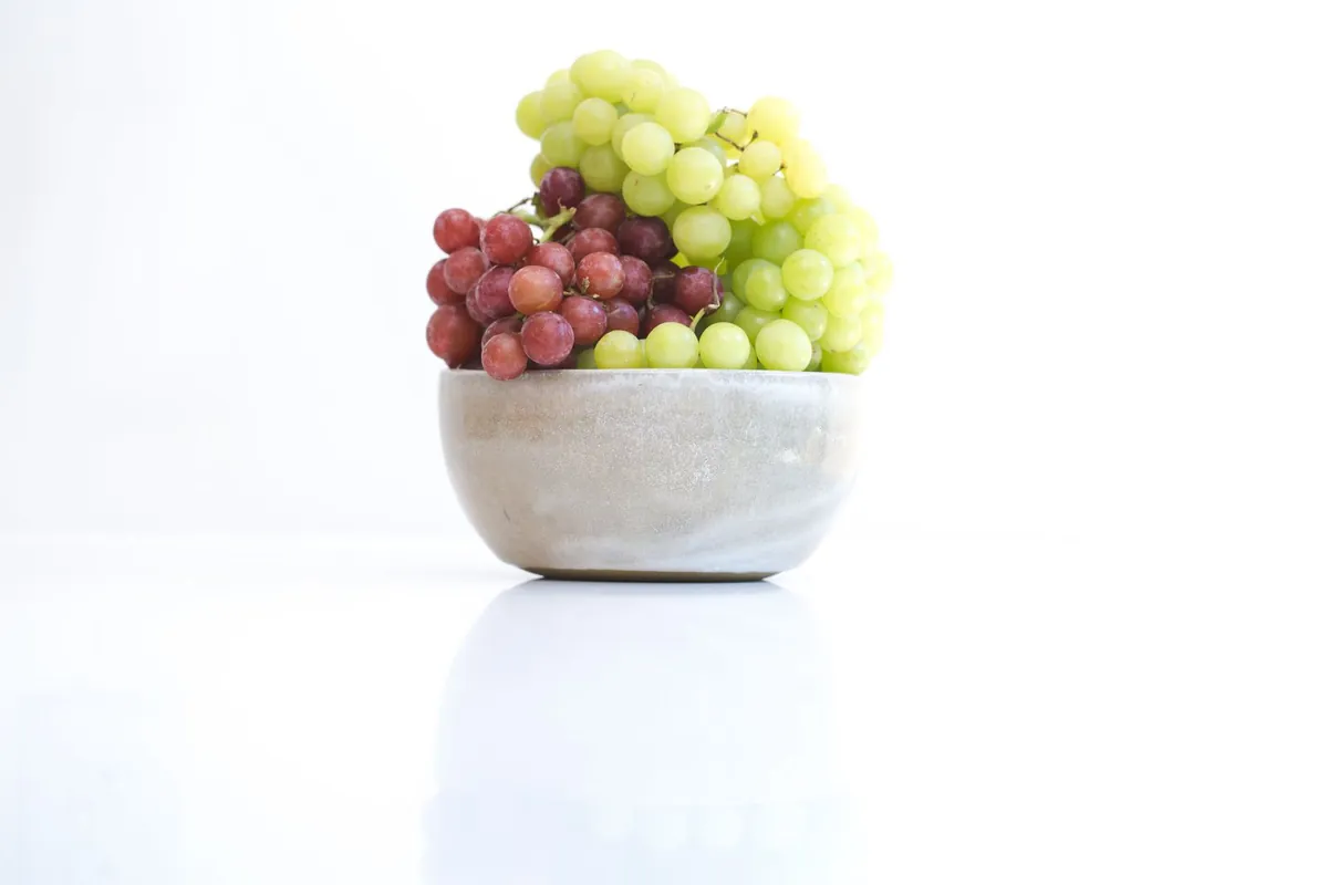 Grape clusters at peak fall season in fruit season chart