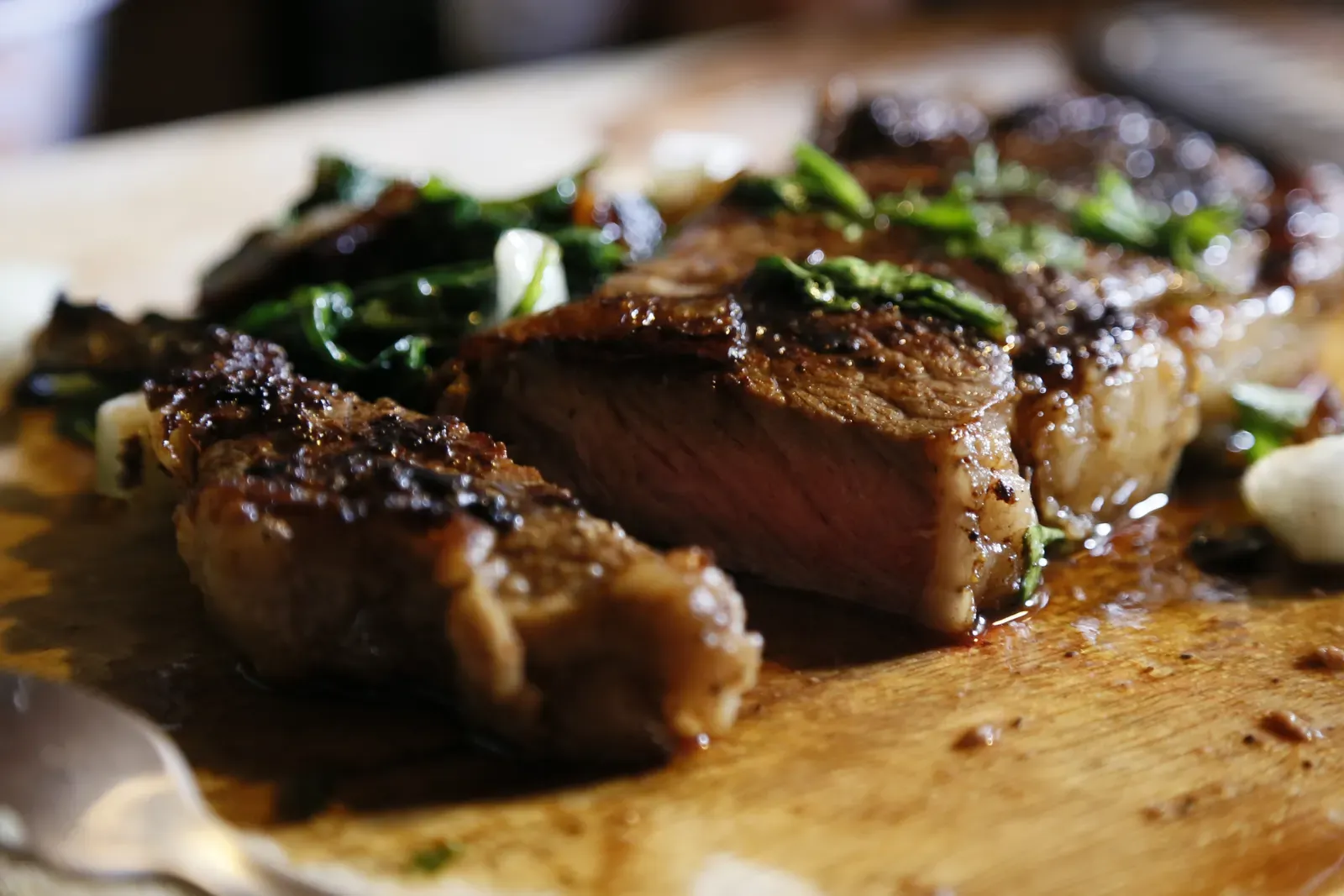 Close-up of juicy sliced steak showing a perfect pink medium-rare center